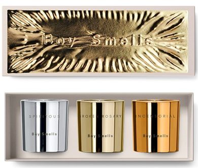 boy smells holiday candle trio