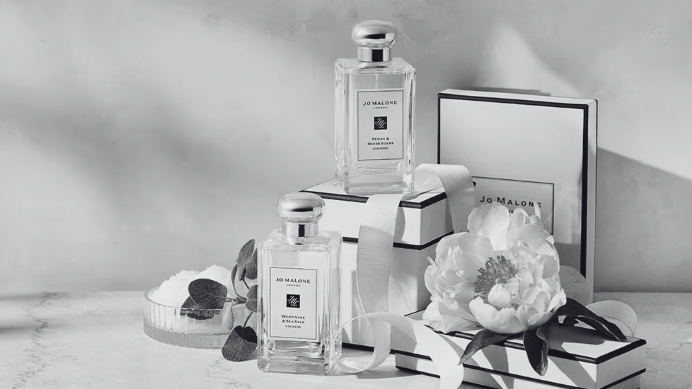 Skincare lifestyle banner featuring luxury serums and a white towel